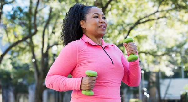 woman walking with hand weights