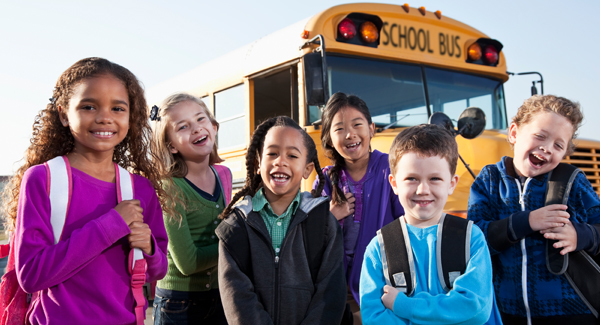 school kids at bus stop