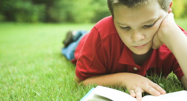 student reading outside